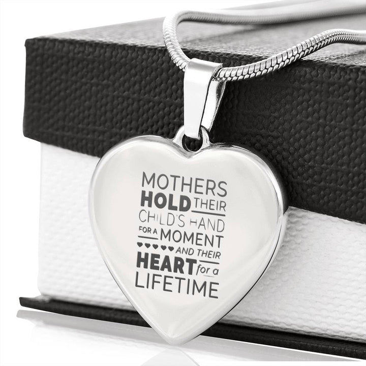 Mother's hold their childs hand - Silver