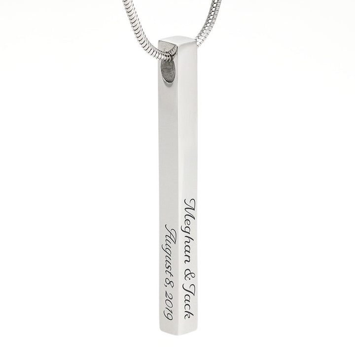 Vertical polished steel stick pendant.